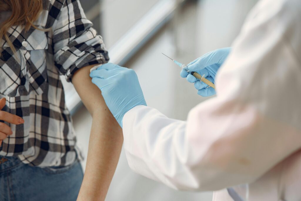 Doctor vaccinating a child